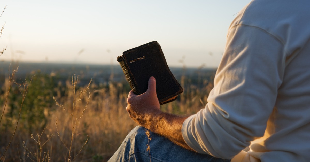 Man holding a Bible