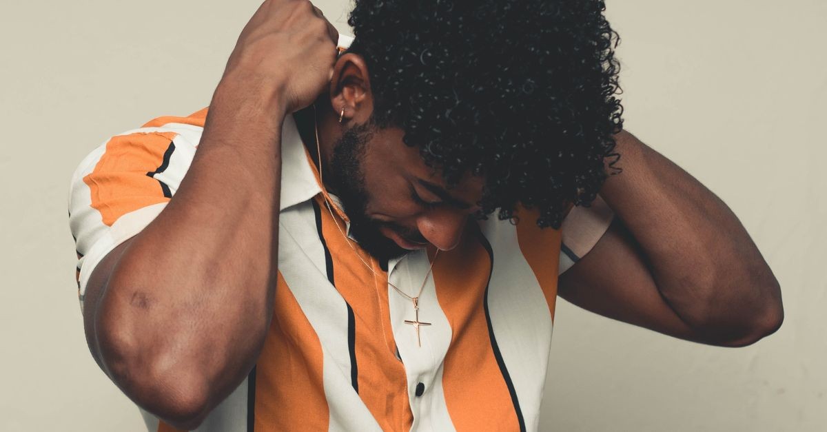 Man wearing a cross necklace