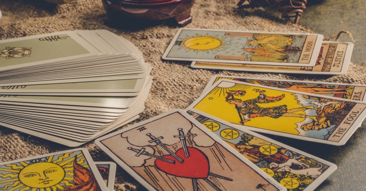 tarot cards spread out on a table, where do tarot cards come from